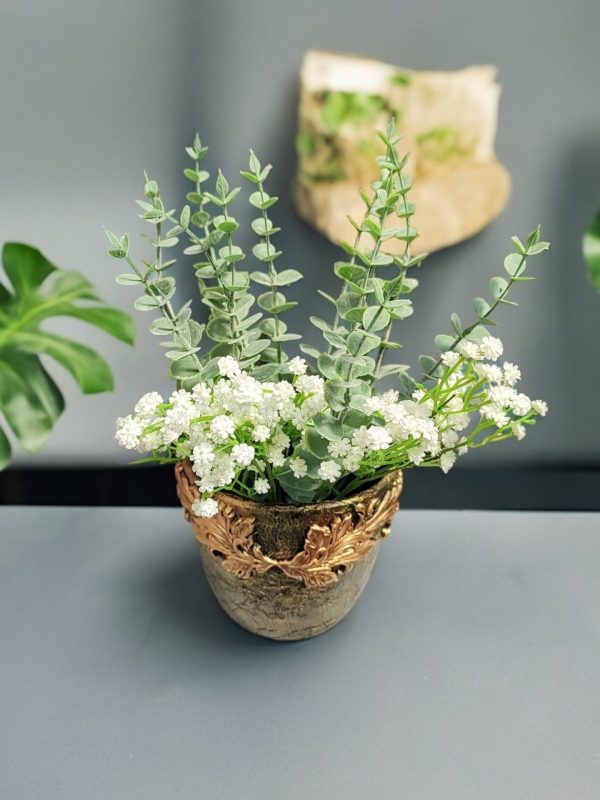 Hand-decorated flower pot with clay embellishments