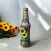 Hand-dcorated sunflower bottle with clay bird embellishments