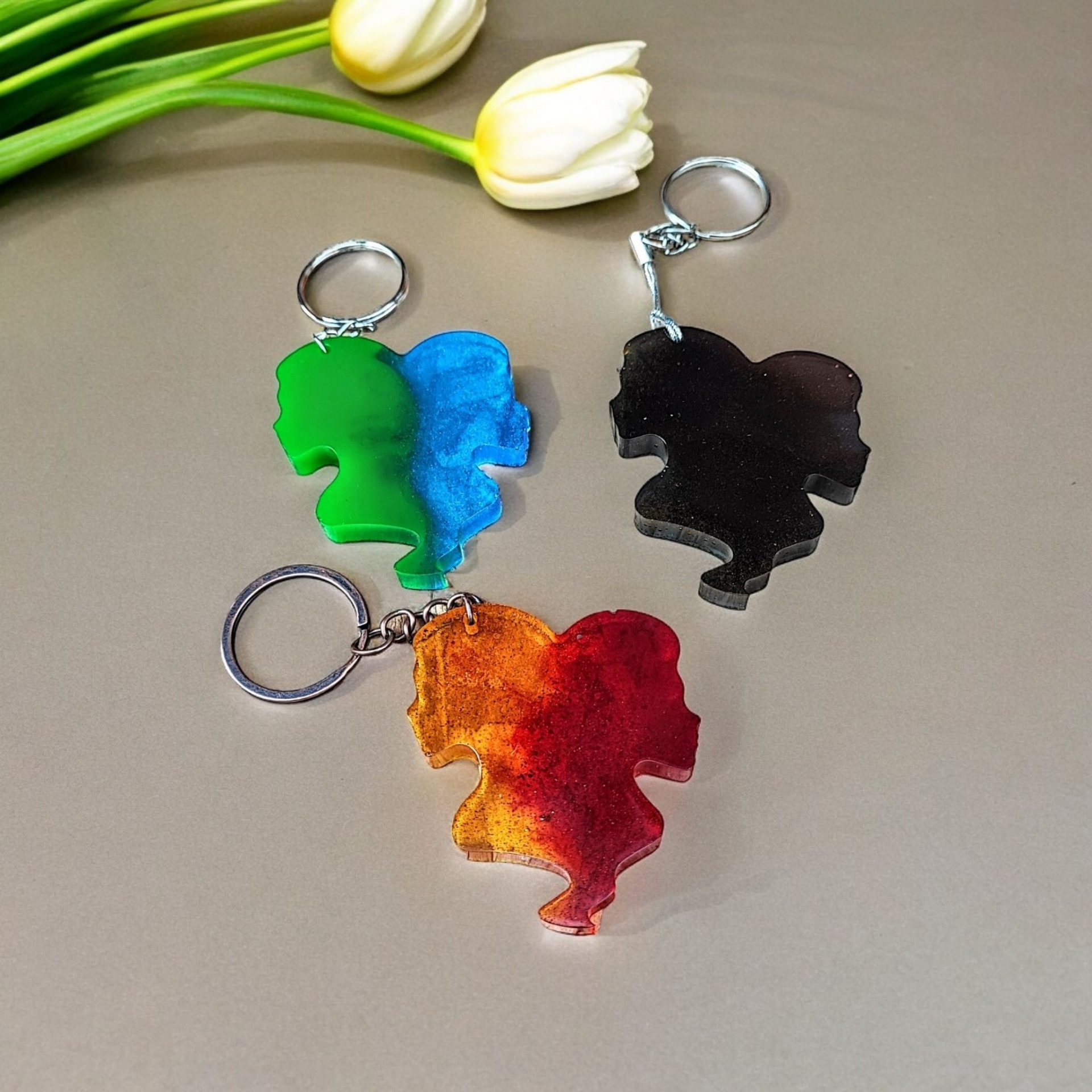 Gemini zodiac sign keyring with a split design showing one half in vibrant colours