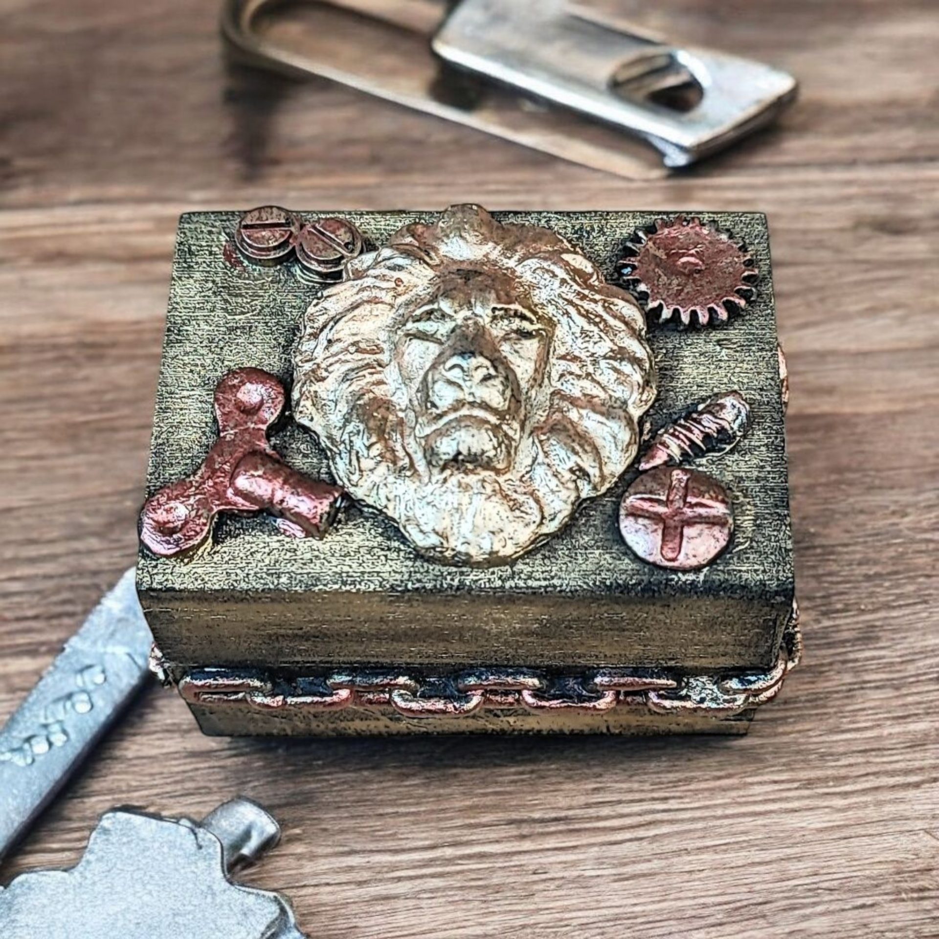 Antique-steampunk style small ring box with clay lion head embellishment.