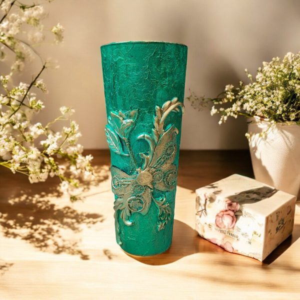 Steampunk-style green flower vase with intricate gold detailing.