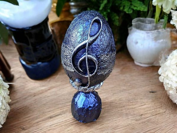 Handmade musical note decorative egg in dark purple and silver with ceramic stans.